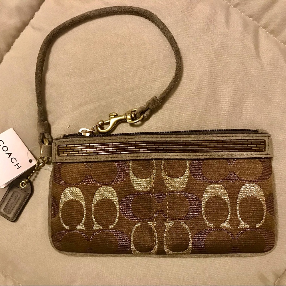 Rare Coach wristlet/chocolate brown & gold/bronze. Measurements 7.5”L & 4”H